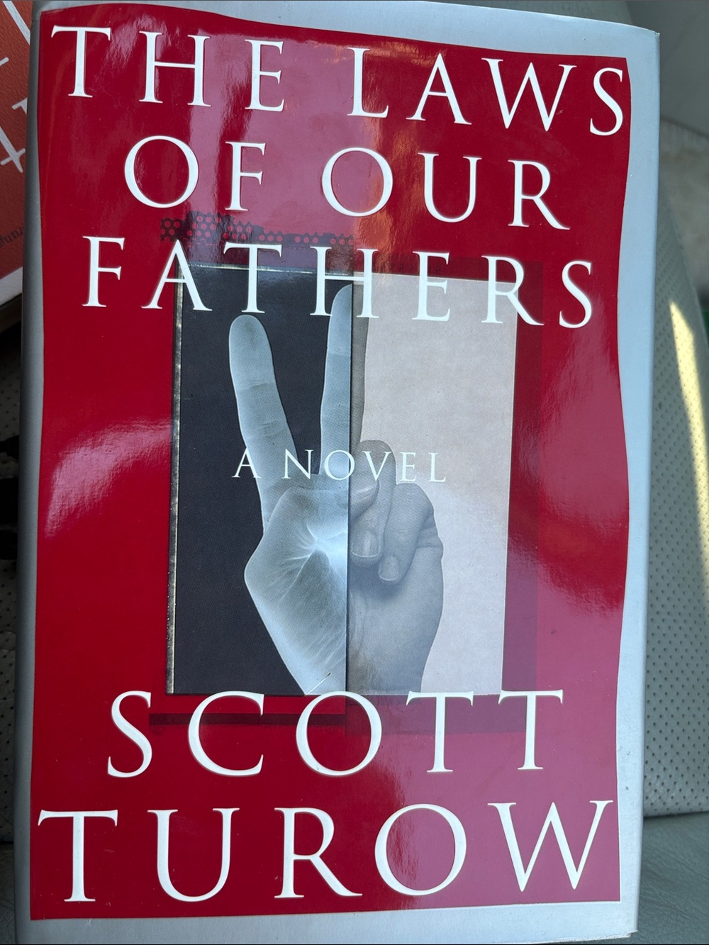 The Laws of Our Fathers by Scott Turow - Red & White Cover